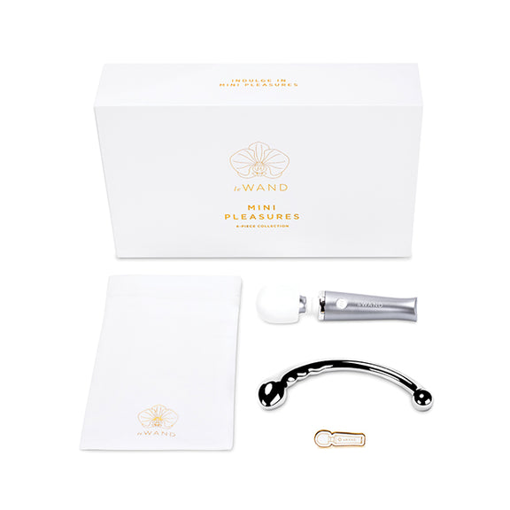 Everything included in th Le Wand Mini Pleasures Kit laying flat in front of the packaging it comes in. It's a nice, rectangular box for easy gift-giving. | Kinkly Shop