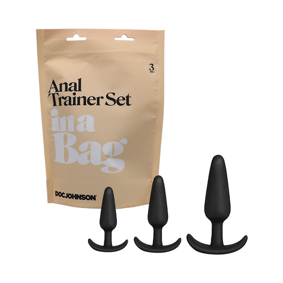 The packaging for the Doc Johnson Anal Trainer Set In A Bag shown next to the three plugs themselves | Kinkly