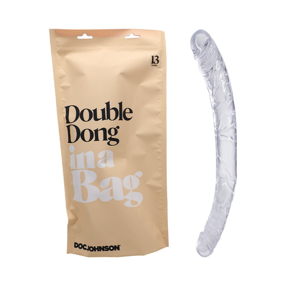 The packaging for the dildo shown next to the Doc Johnson Double Dong In A Bag itself | Kinkly
