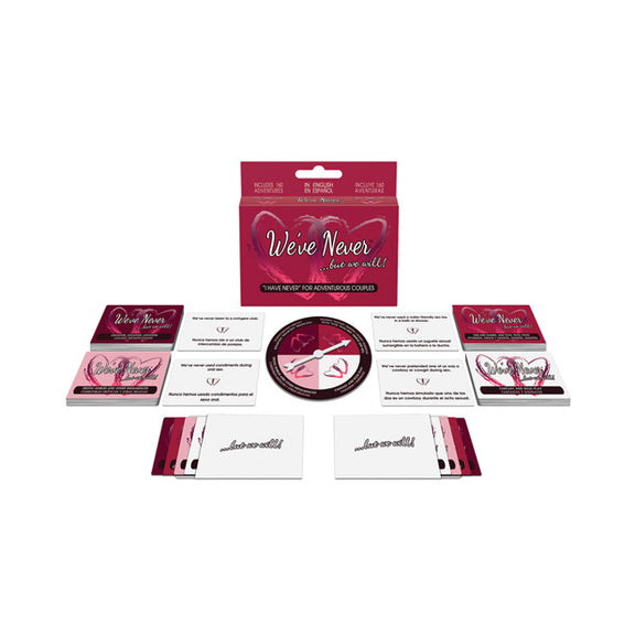 The game box for the "We've Never...But We Will" Board Game surrounded by all of the items that come in it to play the game. | Kinkly