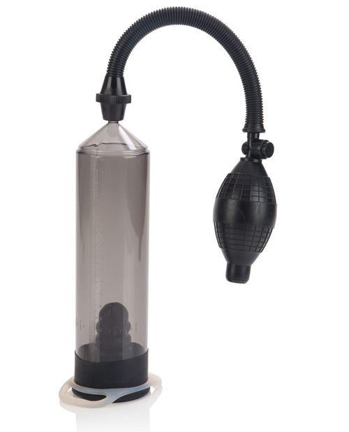 The Optimum Series Precision Pump in front of a plain white background with the cock ring wrapped around the pump's base, showcasing how it can be left there until you're ready to use it. | Kinkly Shop