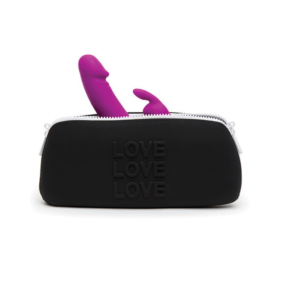 A rabbit vibrator sticks out the top of the Love Medium Silicone Storage Bag from between the zippers. The bag looks large enough to easily fit this full-sized rabbit vibrator in it. | Kinkly Shop