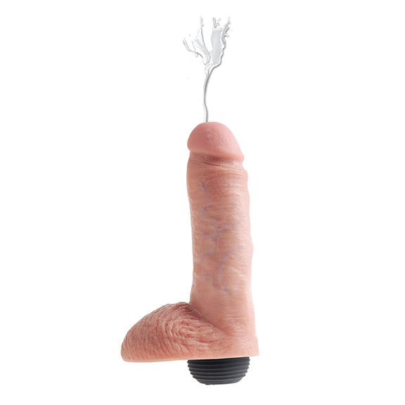 The King Cock 8" Squirting dildo shown squirting. The squirt bulb is inserted into the base of the dildo. | Kinkly Shop