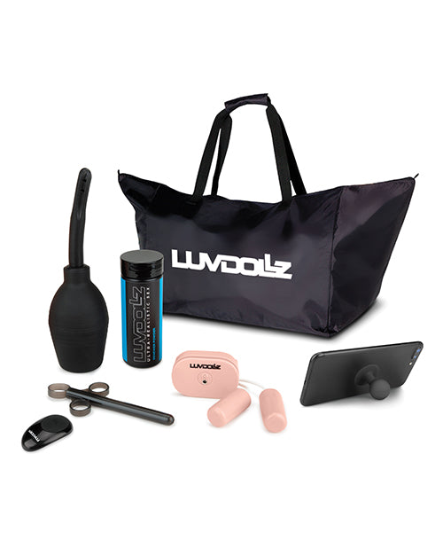 The accessory kit for the LuvDollz doll. It includes an enema bulb, lube shooter, renewal powder sample, wireless remote, two bullet vibrators controlled by that wireless remote, a cell phone stand, and a zippered canvas bag with the "LuvDollz" logo on it. | Kinkly Shop