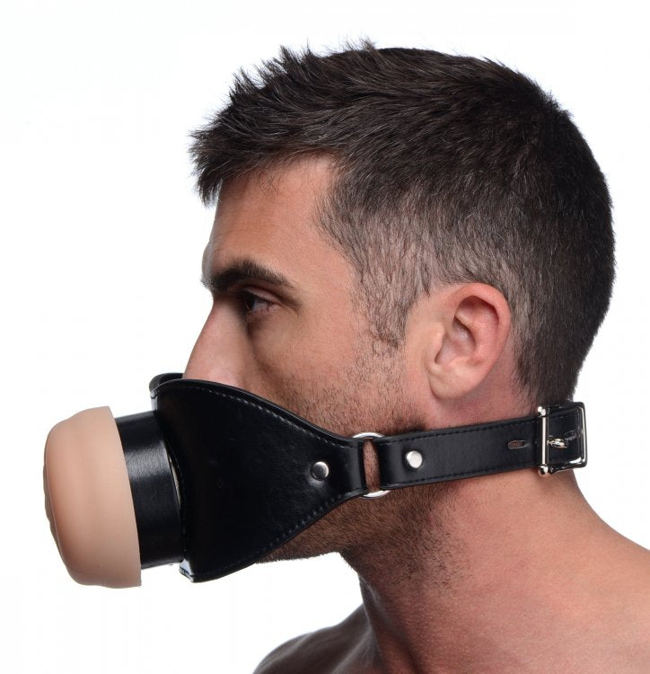 A person wears the Master Series Pussy Face. The Master Series Pussy Face gag protrudes very far away from their lips and mouth. | Kinkly Shop