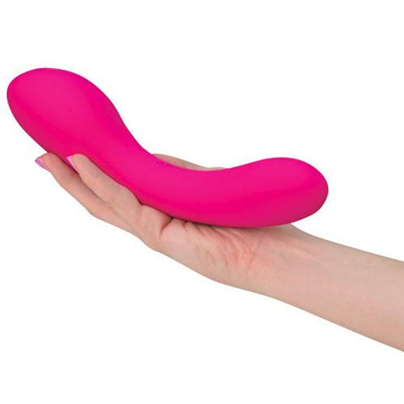 A person holds the The Swan vibrator in their hand. It looks particularly thick and long in their hand. | Kinkly Shop