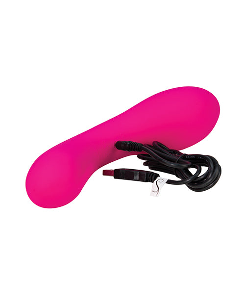 The Swan vibrator shown next to its charging cord sitting on a flat surface. | Kinkly Shop