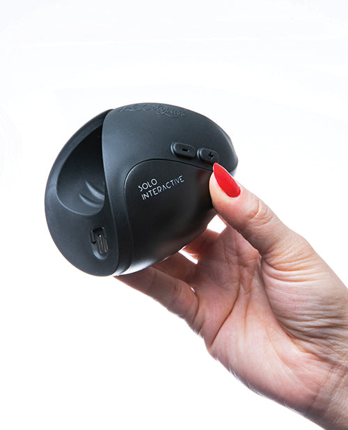 A hand holds the Hot Octopuss Pulse Solo Interactive. It looks like it would fit really comfortably into someone's hand. | Kinkly Shop