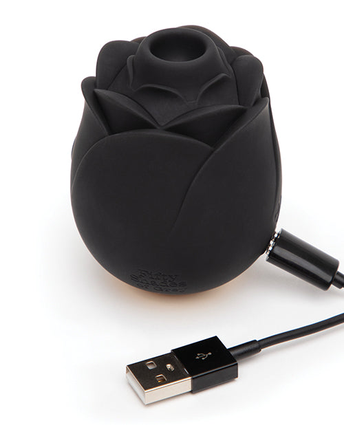 The charger is connected to the base of the Hearts & Flowers Rose. The other side of the charger has a USB that can plug into a device for charging. | Kinkly Shop