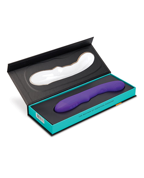 The Nu Sensuelle Vivi Tapping Vibe lays in the opened-up packaging, showcasing how it fits into the box. | Kinkly Shop