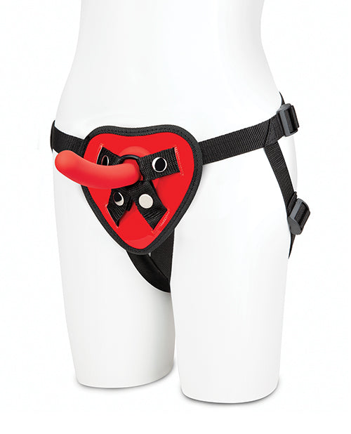 A mannequin wears the Lux Fetish Red Heart Strap-On Set hip harness around the hips with the dildo in the O-ring. | Kinkly Shop