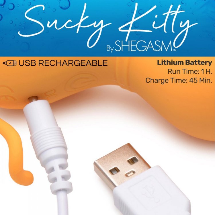 Close-up of the Inmi Shegasm Sucky Kitty plugged in to charge. Text on the image says: "USB rechargeable. Lithium battery. Run time: 1 hour. Charge time: 45 minutes" | Kinkly Shop