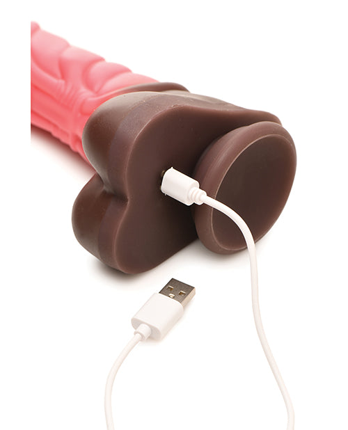 The charging cable is plugged into the base of the Creature Cocks Thrusting Centaur with Remote Control. The charging port is under the balls of the dildo. | Kinkly Shop