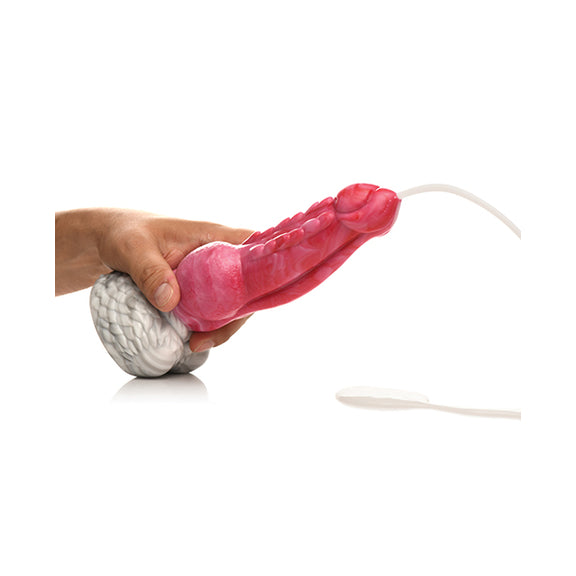A hand holds the Creature Cocks Resurrector Phoenix Squirting as the tip of the dildo squirts out a large stream of cum lube. | Kinkly Shop
