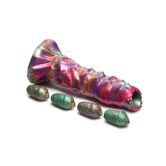 The Creature Cocks Larva Ovipositor with Eggs shown with the dildo and the four included silicone eggs it comes with. | Kinkly Shop