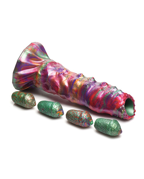 The Creature Cocks Larva Ovipositor with Eggs shown with the dildo and the four included silicone eggs it comes with. | Kinkly Shop