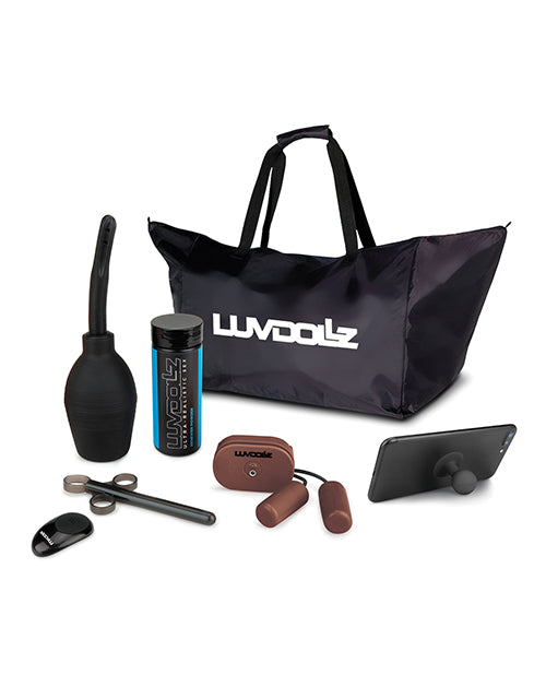 The accessory kit for the LuvDollz doll. It includes an enema bulb, lube shooter, renewal powder sample, wireless remote, two bullet vibrators controlled by that wireless remote, a cell phone stand, and a zippered canvas bag with the "LuvDollz" logo on it. | Kinkly Shop