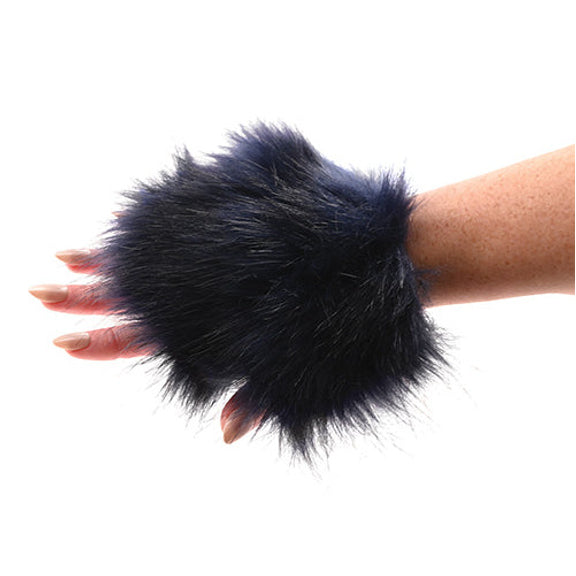 A hand is inside of the Sportsheets Cougar Spiked Sensory Glove. It looks like a glove that leaves all of the fingers poking out from the glove like a fingerless glove. | Kinkly Shop