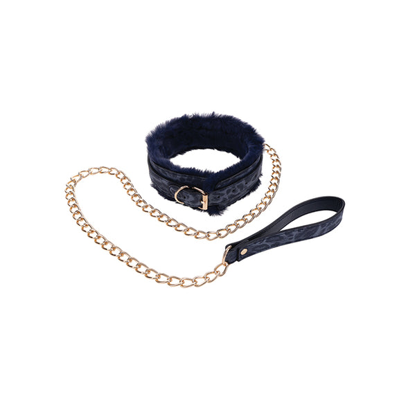 The backside of the Sportsheets Cougar Fur Collar & Leash. The collar has matching gold hardware with a standard fastening buckle. The leash matches in material color and metal. | Kinkly Shop