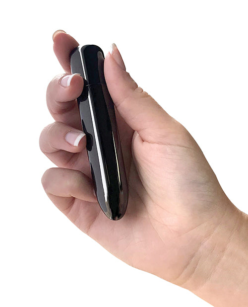 A hand holds the PowerBullet Bullet Point. It looks to be about the length of the palm of their hand (diagonally) with a width that's slightly wider than one finger. | Kinkly Shop