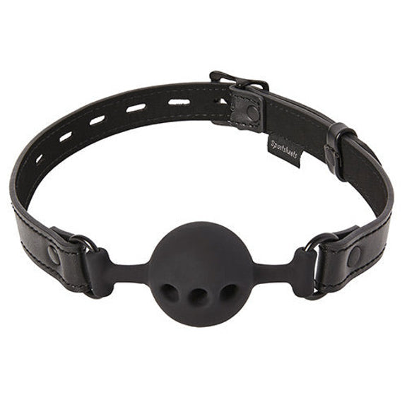 Sportsheets Saffron Breathable Ball Gag in front of a plain white background. The ball itself has three holes in it to make it easier to breathe through. | Kinkly Shop