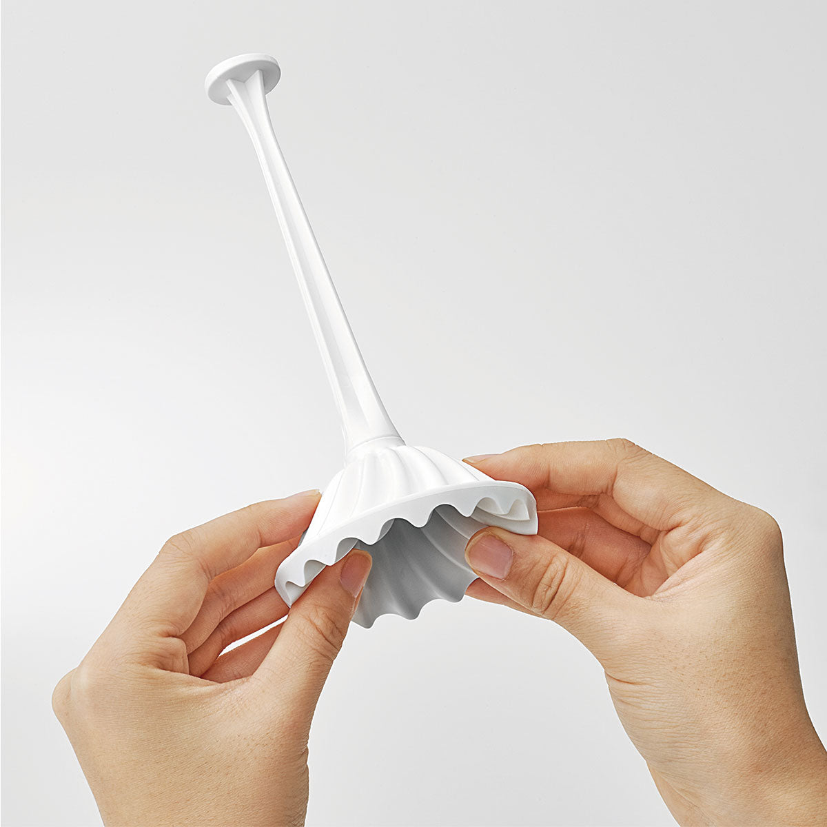 The TENGA Flex lid flipped inside out, showcasing how it doubles as the stroker's lid as well as the drying stand. | Kinkly Shop