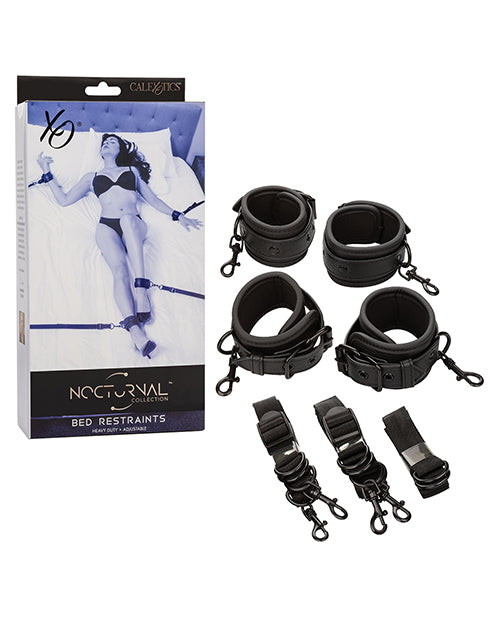 Packaging shown next to the four cuffs and tether straps that make up the Nocturnal Collection Adjustable Bed Restraints | Kinkly Shop