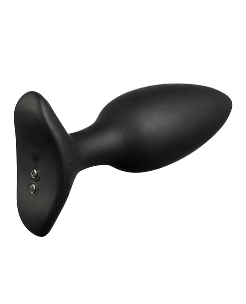 Close-up of the base of the Lovense Hush 2 where there are two magnetic charging ports and the power/control button for the toy. The base is oval-shaped to better fit between the cheeks. | Kinkly Shop