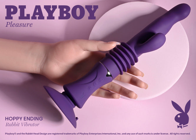 A hand holds the Playboy Hoppy Ending. The vibrator is really long in their hand. I think the vibrator may be the size of this person's forearm in length. | Kinkly Shop