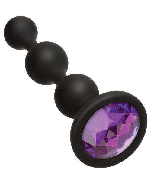 Close-up on the plastic gem that's inlaid inside of the base of the Booty Bling Beads | Kinkly