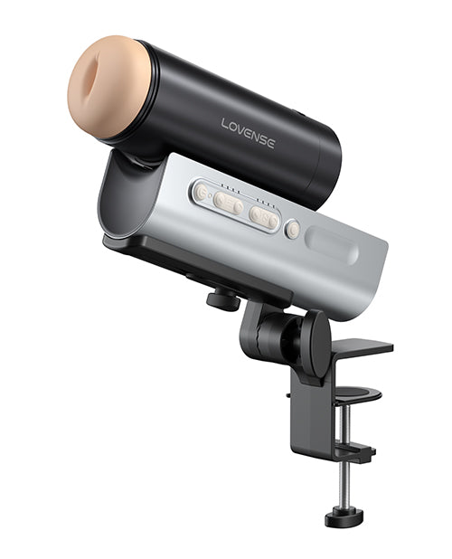 The Lovense Solace Pro attached to the desk clamp and shown upright. | Kinkly