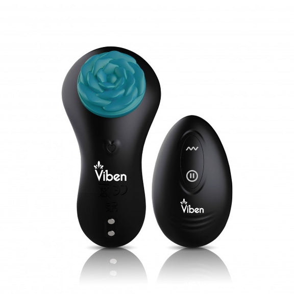 The Viben Secret Seduction panty vibrator shown next to the palm-sized remote control that controls the vibrations. The magnet that fastens the vibe onto panties is a small rose design. | Kinkly