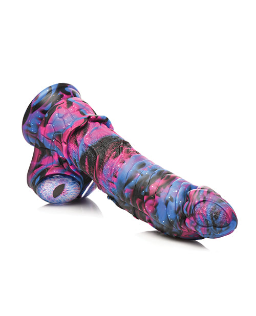 The Creature Cocks Alienoid laying on a flat surface. The dildo looks firm enough to hold its shape. | Kinkly Shop