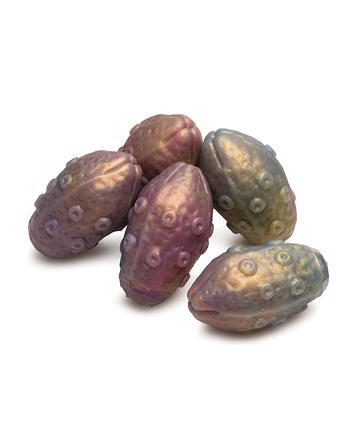 All five of the included silicone eggs laying in a pile with one another. They color-match the dildo. | Kinkly Shop