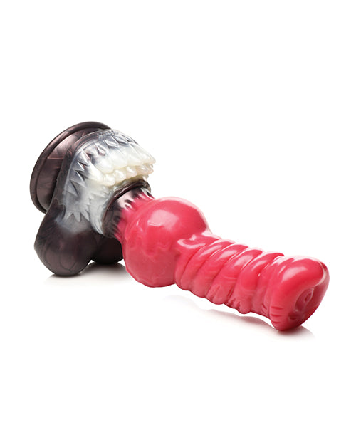 The Creature Cocks Cujo lays on its side. The insertable shaft of the dildo has a twisted shaft design. | Kinkly Shop