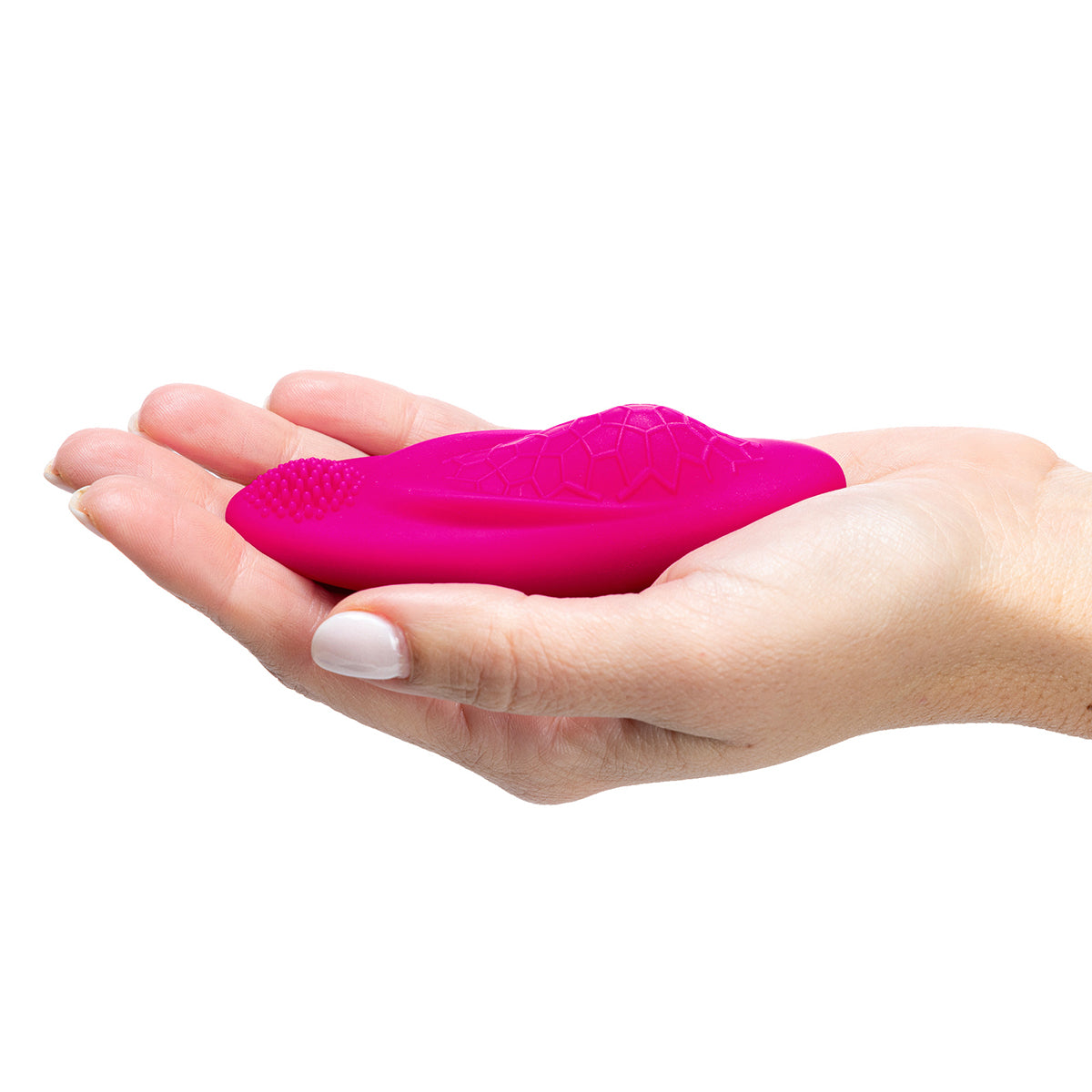 The OhMiBod Foxy is resting in a person's cupped hand. The panty vibrator looks dainty and like it fits easily in a person's hand. | Kinkly