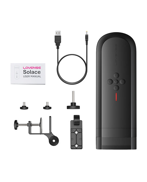 Everything included with the Lovense Solace. This includes the stroker, the charging cable, the desk mount, and the instructions. | Kinkly