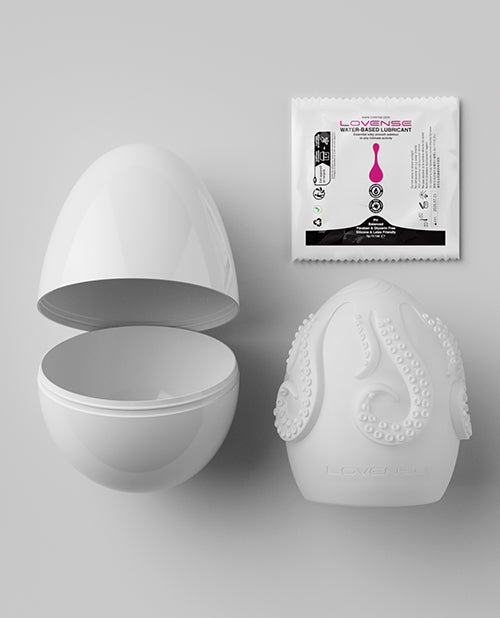 Everything included with the Lovense Kraken Egg including the plastic packaging, the TPE stroker itself, and a sample-sized packet of lube | Kinkly Shop