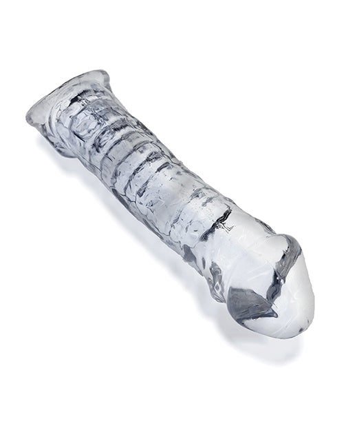 The clear Oxballs Muscle Bandit Cocksheath. The see-through design makes it easy to see the rippled texture inside of the penis extender. | Kinkly