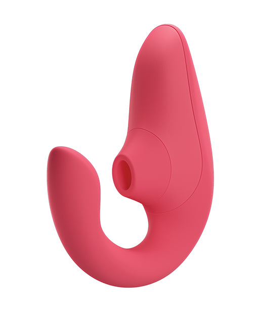 The Womanizer Blend with the insertable g-spot shaft towards the camera. The other end of the U-shaped toy has a hollow tip for air suction pleasure. | Kinkly