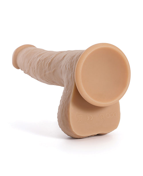 Close-up of the suction cup on the base of the Idalis Wireless Thruster. The manual control button for the dildo is also on the underside of the testicles. | Kinkly Shop