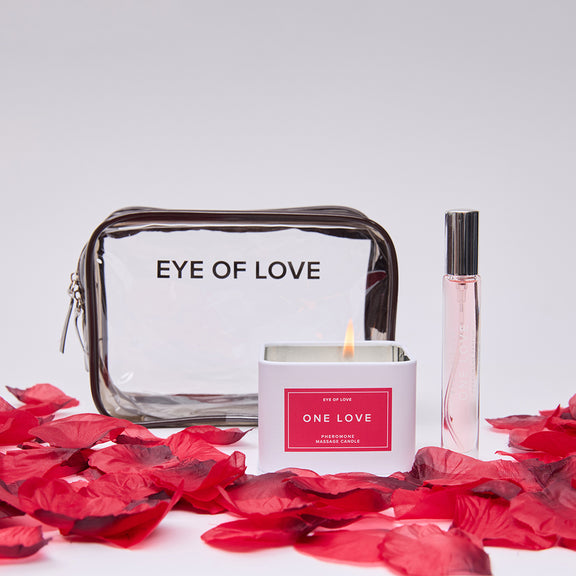 Everything that's included with the One Love Attract Him Gift Set. It's the candle, perfume, rose petals, and the storage bag. | Kinkly
