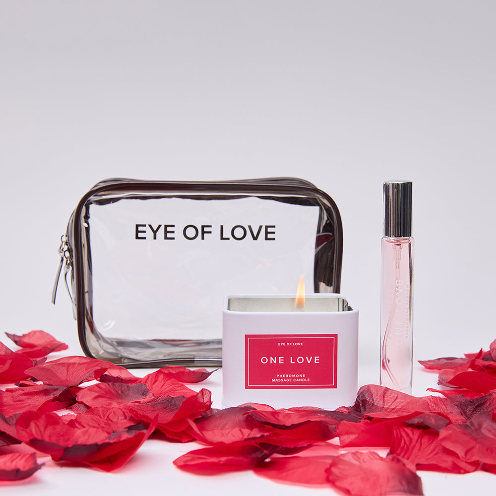 Everything that's included with the One Love Attract Him Gift Set. It's the candle, perfume, rose petals, and the storage bag. | Kinkly