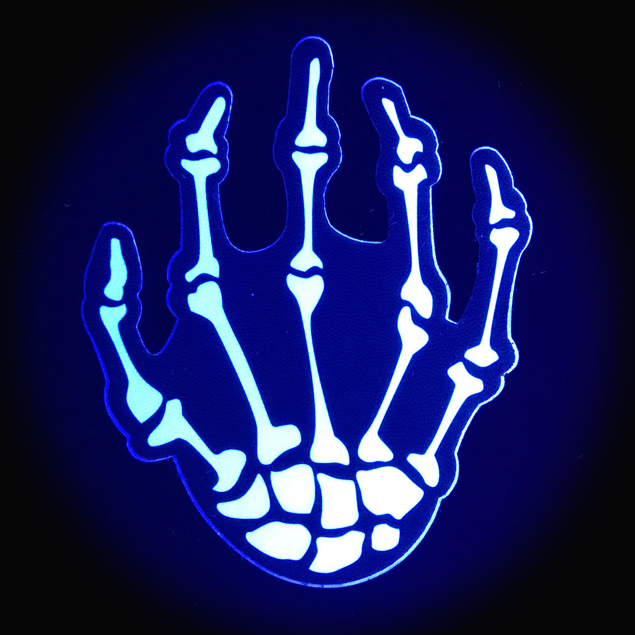 The Pastease Skeleton Hands shown how they'd look in the dark. They have a glow-in-the-dark look to them. | Kinkly
