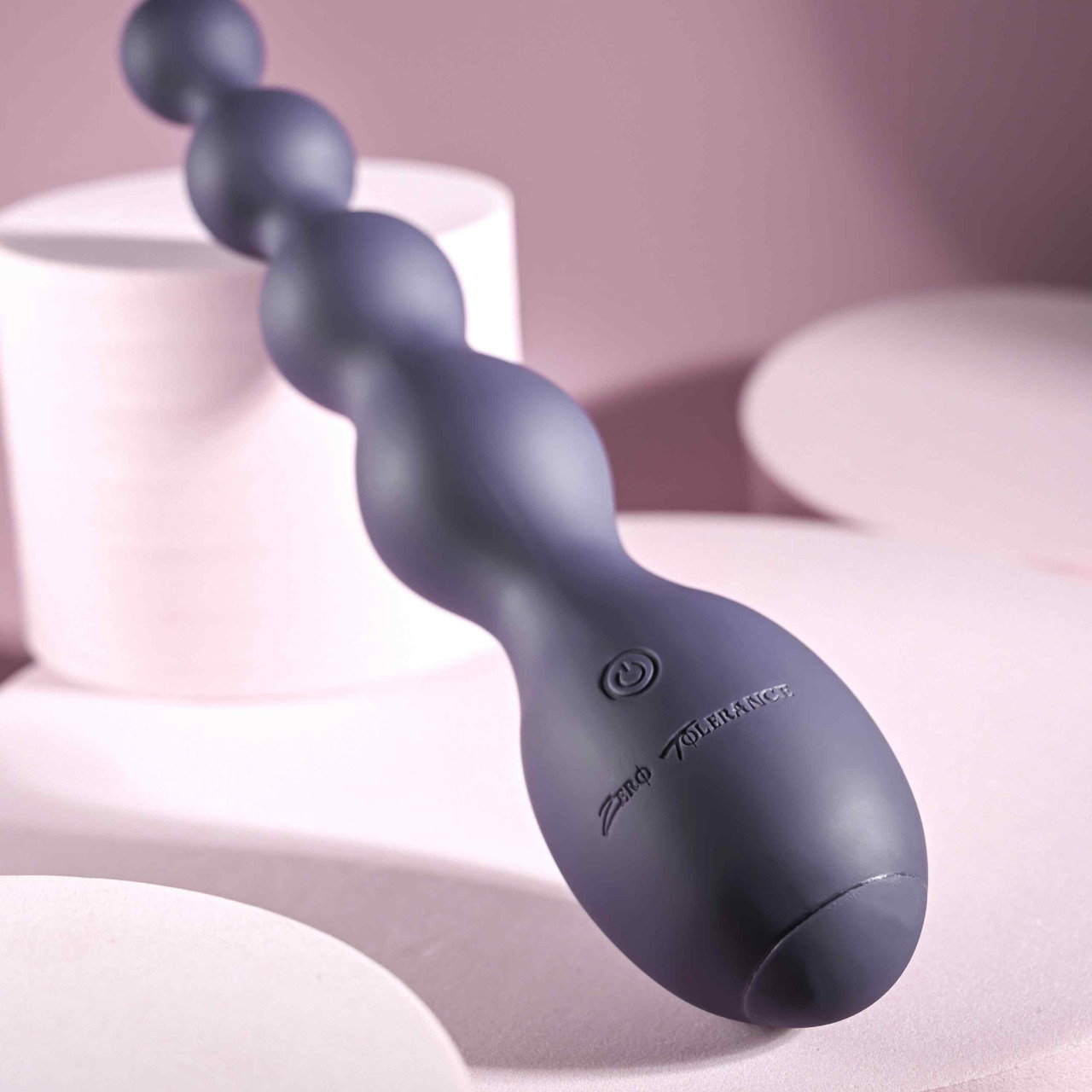 Close-up on the Zero Tolerance Rumpy Bumpy on the base. There's a single power button on the base. | Kinkly Shop