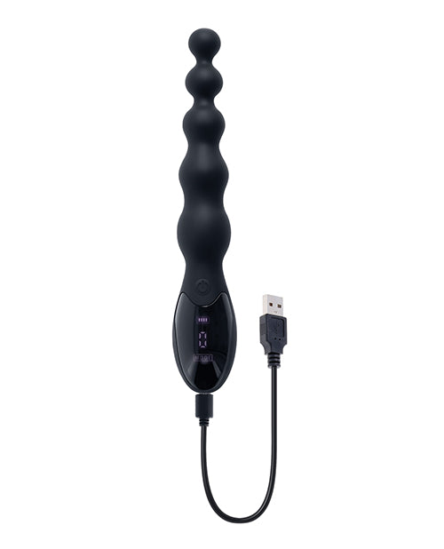 The Zero Tolerance Backdoor Baton shown plugged into the charging cable that charges it. | Kinkly Shop