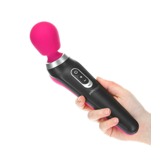 A hand holds the Palm Power Extreme. The vibrator's handle looks like it fits comfortably in their palm. | Kinkly