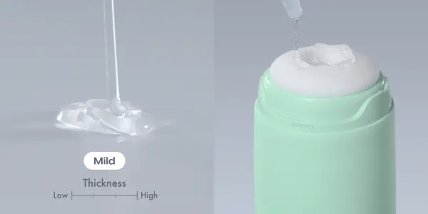 Two videos turned into a GIF showcasing the Mild lube being poured into a pile next to the lube being smeared around the entrance of a Tenga stroker. | Kinkly Shop