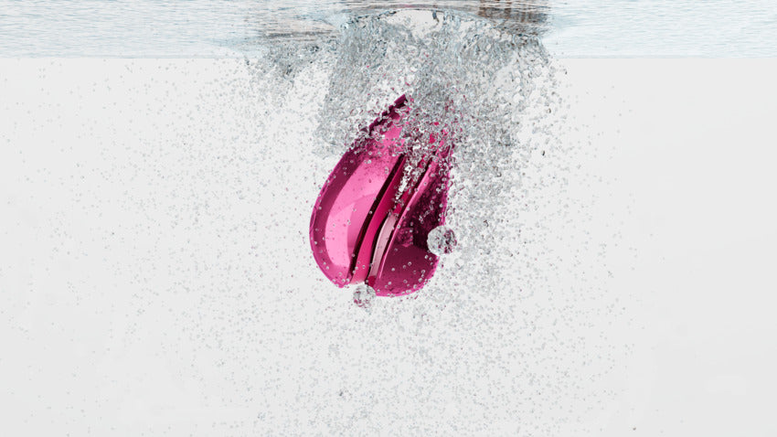 The Womanizer x Iggy Azalea Liberty 2 submerged in water, showcasing the toy's waterproof capabilities. | Kinkly Shop