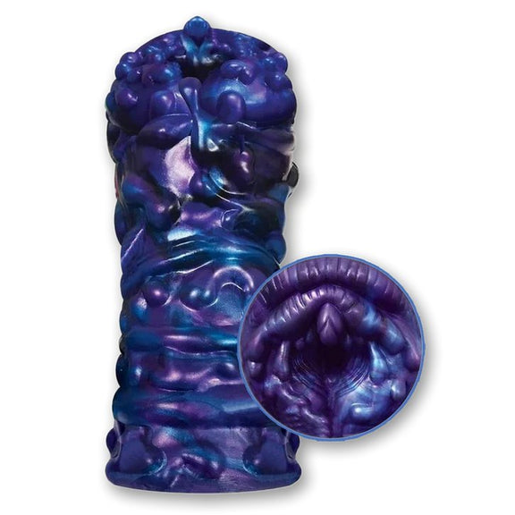 The Alien Nation Lagos in front of a plain white background. The stroker is extremely textured on the outside. | Kinkly Shop